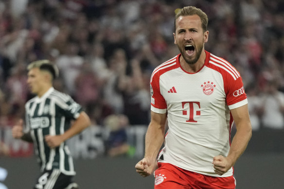 Star recruit Harry Kane celebrates after netting Bayern’s third goal in Munich.