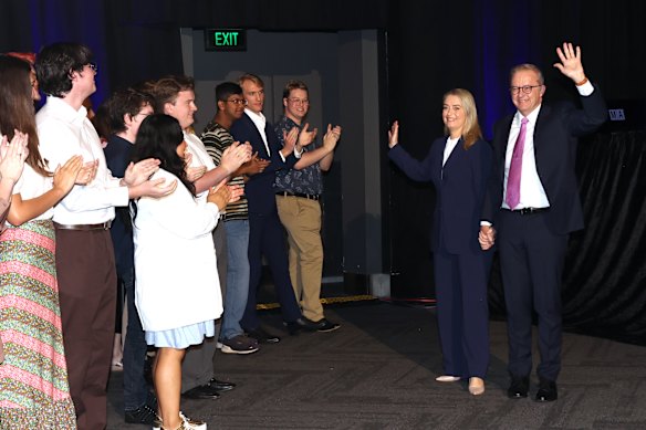 Jodie Haydon and Anthony Albanese wave to the Labor faithful.