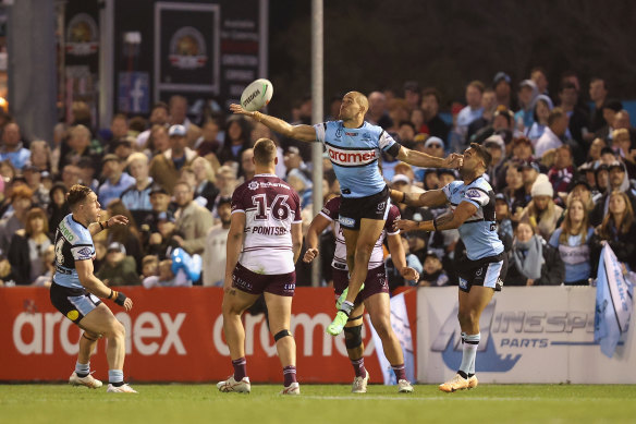 Will Kennedy contests a high ball for the Sharks.