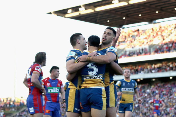 The Eels celebrate Haze Dunster’s try during the big win over Newcastle.