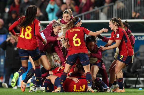 Spanish players celebrate victory in Auckland.