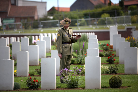 A lone Australian soldier inspects the empty cemetery after the ceremony to dedicate Fromelles Military Cemetery in July 2010.
