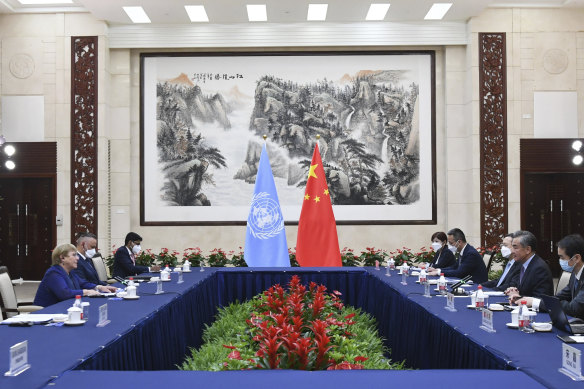 Chinese Foreign Minister Wang Yi, second right, meets with the United Nations High Commissioner for Human Rights Michelle Bachelet, left, in Guangzhou, southern China’s Guangdong Province.