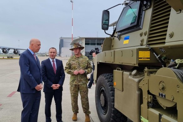 Defence Minister Peter Dutton inspects one of the Bushmaster vehicles with  Ukraine’s ambassador to Australia Vasyl Myroshnychenko. 