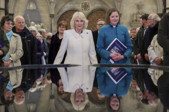 Queen Camilla takes a moment of reflection at The Salisbury font, designed by British water sculptor William Pye during a Musical Evening at Salisbury Cathedral to celebrate the work of local charities on February 8.