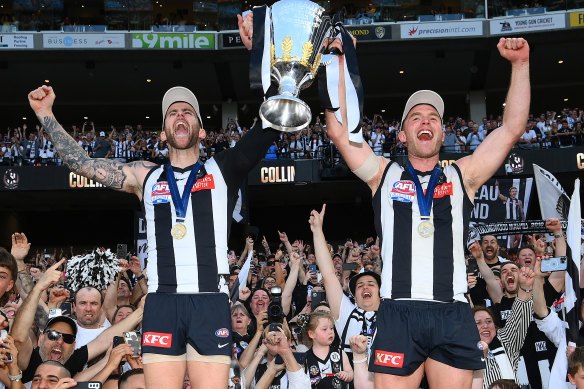 Jeremy Howe and Tom Mitchell lif tthe premiership cup.