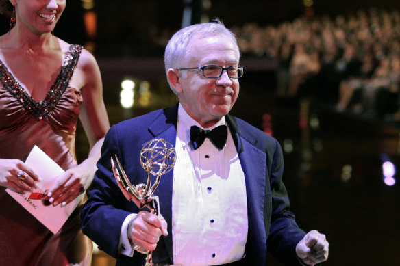 Leslie Jordan carries his award for outstanding guest actor in a comedy series, for his work on Will & Grace, during the Creative Arts Emmy Awards in Los Angeles in 2006.