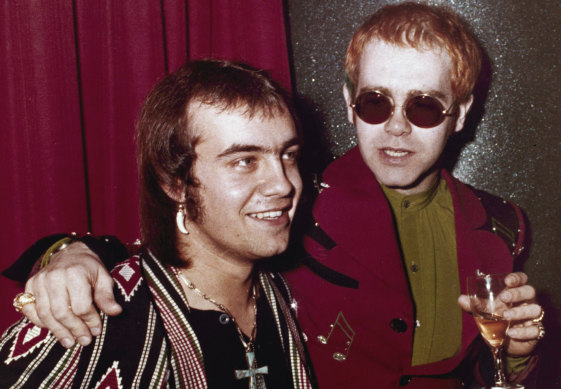 Bernie Taupin and Elton John celebrate their success in early 1973.
