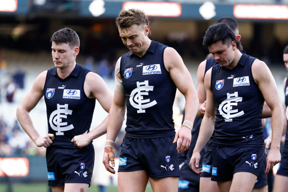 Dejected Carlton skipper Patrick Cripps (centre) after his side’s heavy defeat.