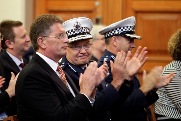 Then premier Ted Baillieu celebrates the graduation of 20 protective services officers with Commissioner Ken Lay in 2012. 