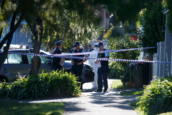 Police at the scene of a fatal domestic violence stabbing in Russell Lea on Thursday. 