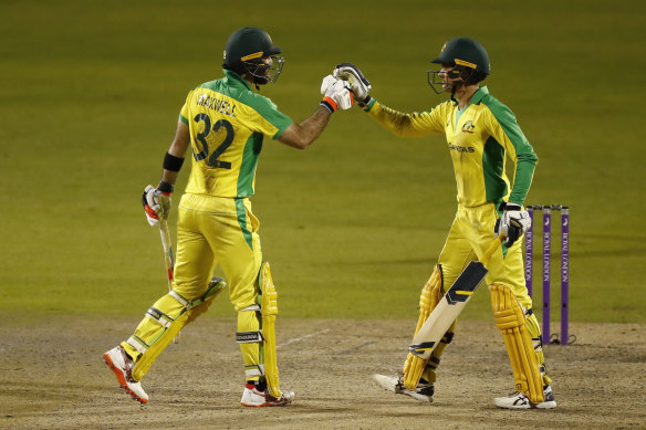 Australia's Glenn Maxwell (left) celebrates with Alex Carey. Both players scored centuries.