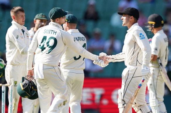 Steve Smith and Tom Blundell shake hands after Australia's dominant Boxing Day Test win.