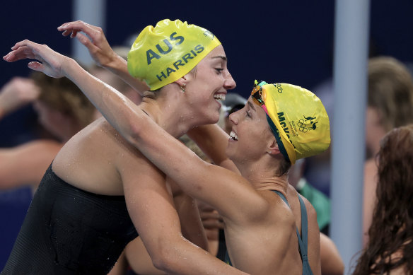 McKeon celebrates victory in the 4x100m freestyle relay with teammate Meg Harris.