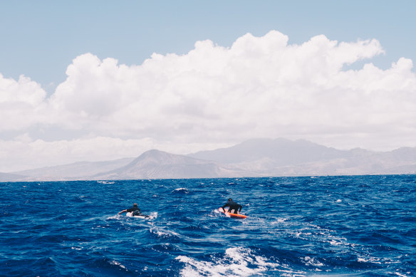 Long, lonely road: Brett Connellan (right) and his support guide Brad Gaul in the middle of the Molokai Channel.