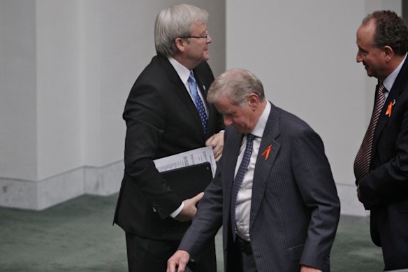 Not this time … Labor MPs Kevin Rudd and Simon Crean walk past each other without a word after Crean’s leadership intervention, March 2013. 