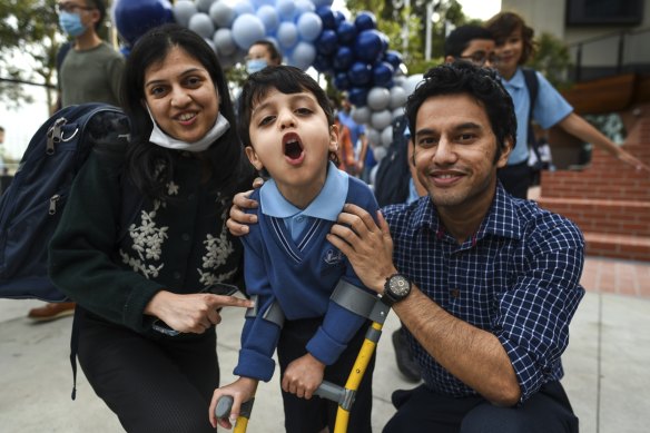 Happy day: Prep student Ishan Naik, 5, with parents Rajesh and Gauri on opening day of Docklands Primary School. 