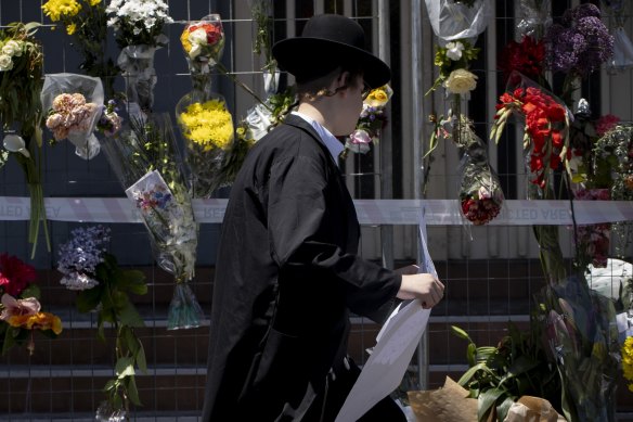 Community members have laid flowers outside the Adass Israel synagogue following an arson attack on Friday.
