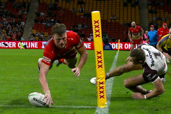 Jack Bostock dives over in the corner to give the Dolphins the lead. Tom Trbojevic injured his hamstring trying to make a try-saving tackle.