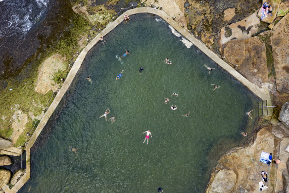 People swim at Maroubra beach as Sydney temperatures soared on Saturday.