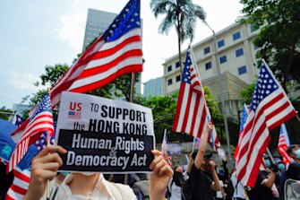 The marchers waved US flags and carried placards.