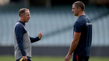 Crows coach Don Pyke with Taylor Walker at training.