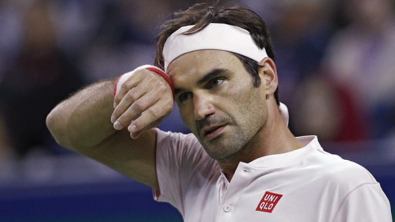 Moving on: Roger Federer during his match with Kei Nishikori.