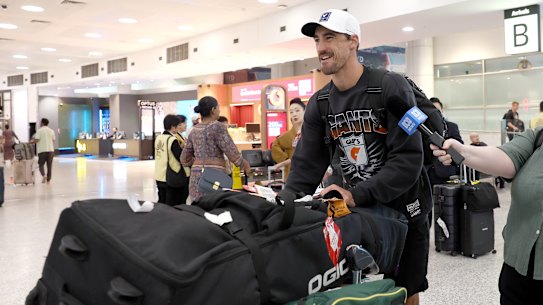 Mitchell Starc arrives home in Sydney on Sunday after the IPL was postponed.
