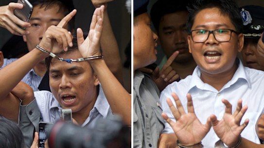 In this combination file image made from two photos, Reuters journalists Kyaw Soe Oo, left, and Wa Lone, are handcuffed as they are escorted by police out of the court in Yangon, Myanmar on September 3.