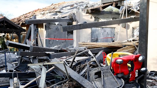 A house lies in ruins after being hit by a rocket in Mishmeret, central Israel, on Monday.