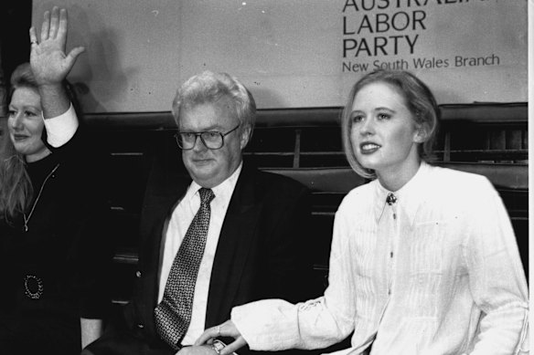 Graham Richardson, with his daughter Katie, salutes his standing ovation in June 1994. “For the last month I have undergone an extraordinary bar­rage, arguably the dirtiest barrage yet launched in the Australian Parliament. It tells me a lot about what I must have done, having resigned and still being a target suggests over the past 20-odd years I must have hurt those bastards. If I hurt the bastards, I am proud to have done so, they deserve every bloody bit of it.”