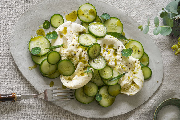 Burrata with cucumber and cumin herb oil.