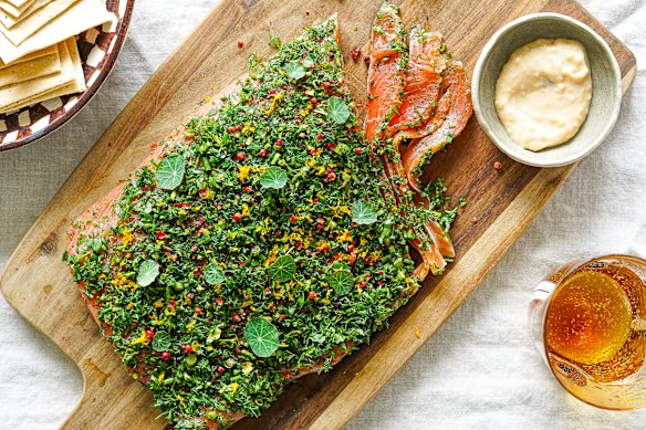 A final flourish of herbs and peppercorns can be added to the salmon gravlax before serving.