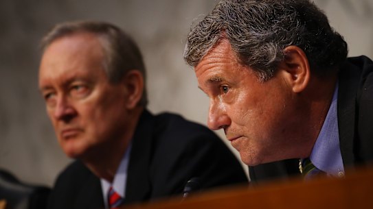 Senator Sherrod Brown of the Senate Banking Committee, right, and Senator Mike Crapo, chairman of the Senate Banking Committee, listen during a hearing about Facebook's cryptocurrency plan.