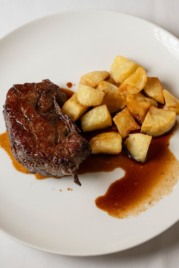 Porterhouse steak with crispy potatoes at Marios in Fitzroy.