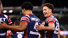 Mark Nawaqanitawase of the Roosters celebrates scoring a try