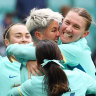 Michelle Heyman is swarmed by Matildas teammates after her goal.
