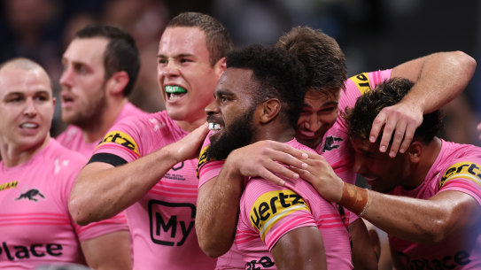 Sunia Turuva celebrates one of his three tries against the Roosters on Thursday night.