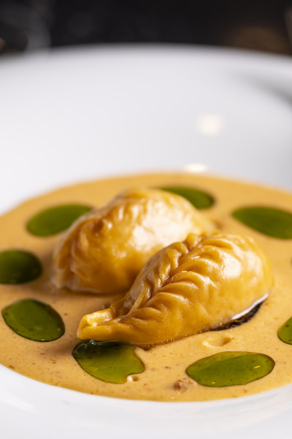 Culurgiones in Thai red curry.