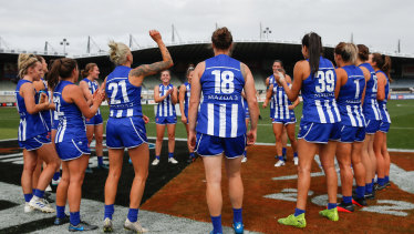 North Melbourne celebrate their close finals win over Collingwood. 