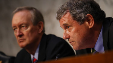 Senator Sherrod Brown of the Senate Banking Committee, right, and Senator Mike Crapo, chairman of the Senate Banking Committee, listen during a hearing about Facebook's cryptocurrency plan.