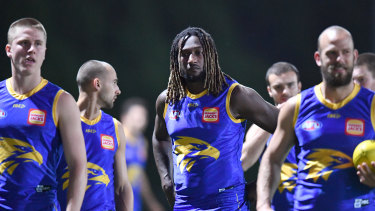 Nic Naitanui (centre) is seen during a West Coast Eagles training session at Metricon Stadium on the Gold Coast.