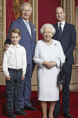 Queen Elizabeth, Prince Charles, Prince William and Prince George pose for a photo to mark the start of the new decade in the Throne Room of Buckingham Palace, London.