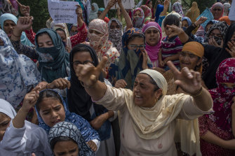 Kashmir Muslim women protesters shout anti Indian slogans during a protest against Indian rule and the revocation of Kashmir's special status, in Srinagar, the summer capital of Indian administered Kashmir, India. 