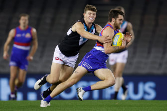 Bailey Williams is chased by Mitch Georgiades.