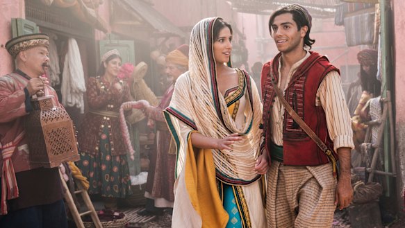 Naomi Scott as Princess Jasmine and Mena Massoud as Aladdin.