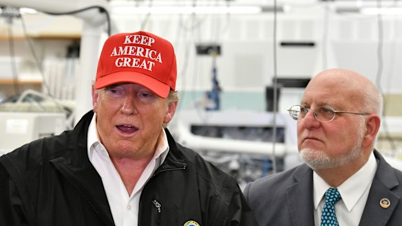 Centres for Disease Control and Prevention boss Robert Redfield, right, said masks may be more effective prevention against the coronavirus than the vaccine. 