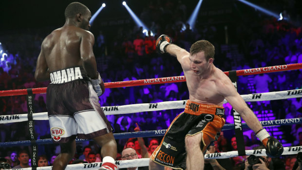 Fighting the very best: Terence Crawford, left, knocks Jeff Horn off balance.
