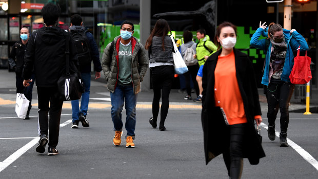 Members of the public wearing face masks in Auckland, New Zealand. 