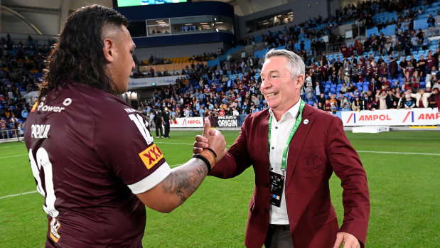 Maroons coach Paul Green celebrates the 20-18 win over NSW with Josh Papalii. 